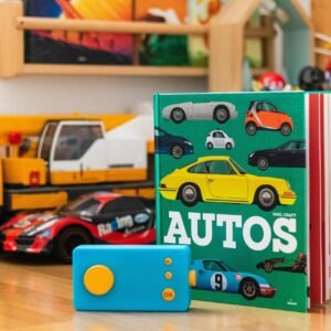 Vibrant display of children's auto book and toy cars set on a wooden surface.